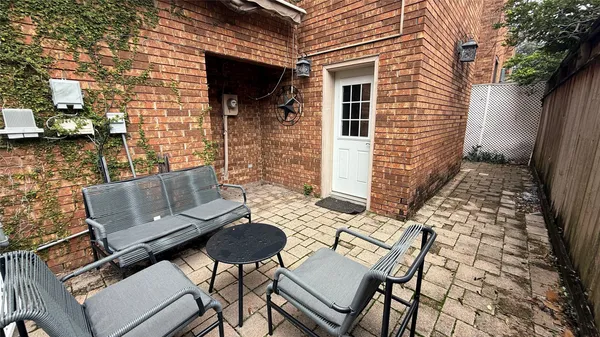 a view of a chairs and table in the patio