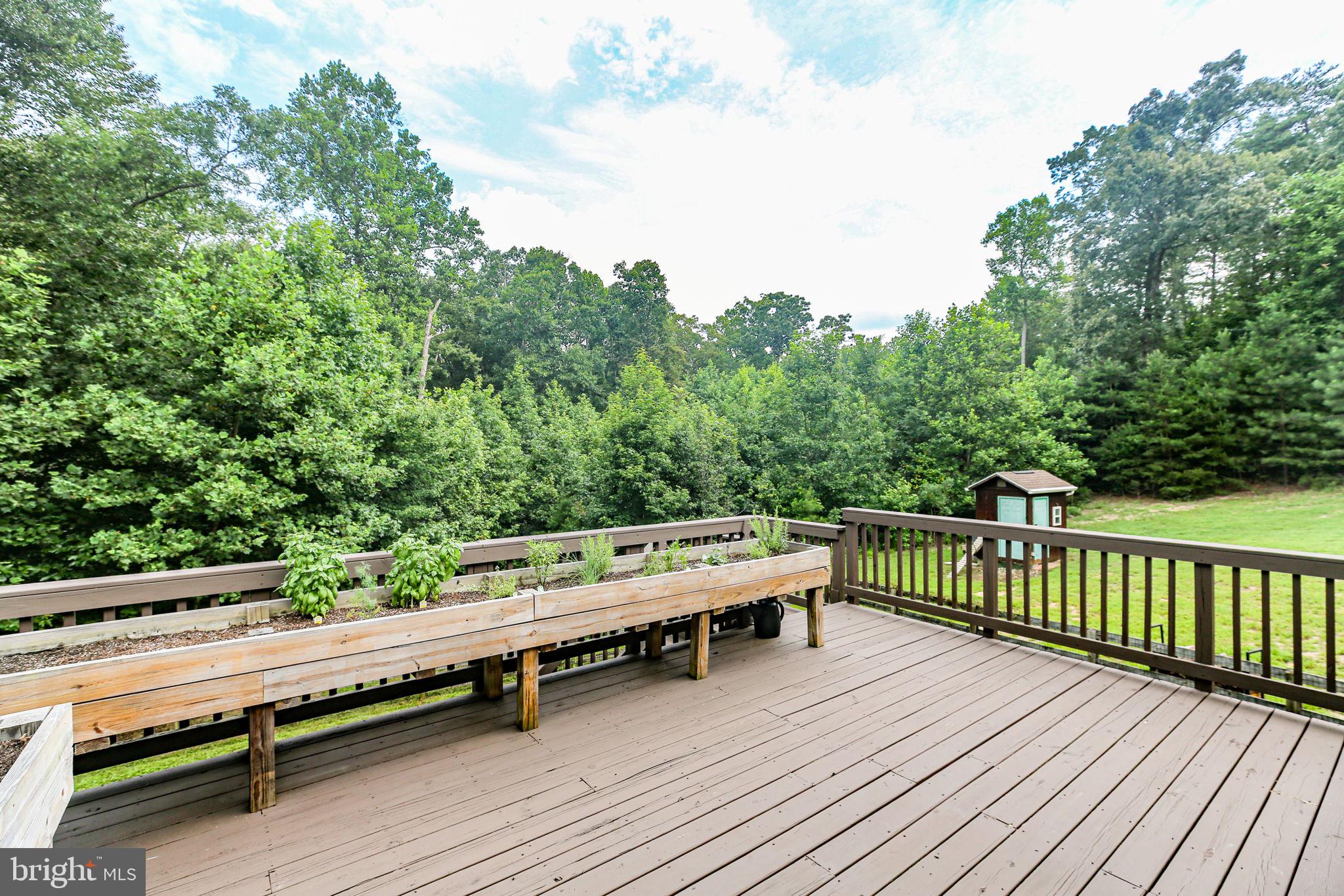 11263 Dahlgren Road King George, VA 22485 - Photo 37 of 47 Deck with potting benches