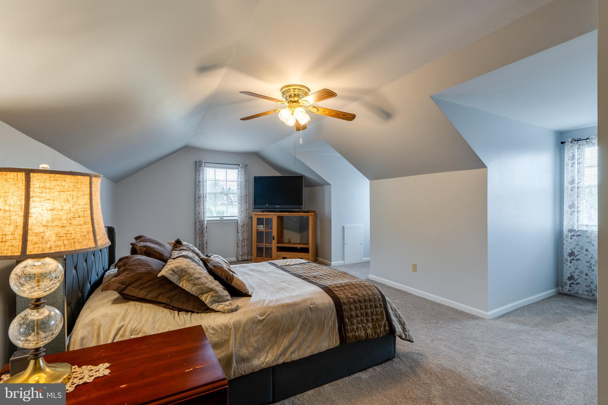 4442 Federal Road York, PA 17408 - Photo 53 of 69 a bedroom with a bed and a chandelier