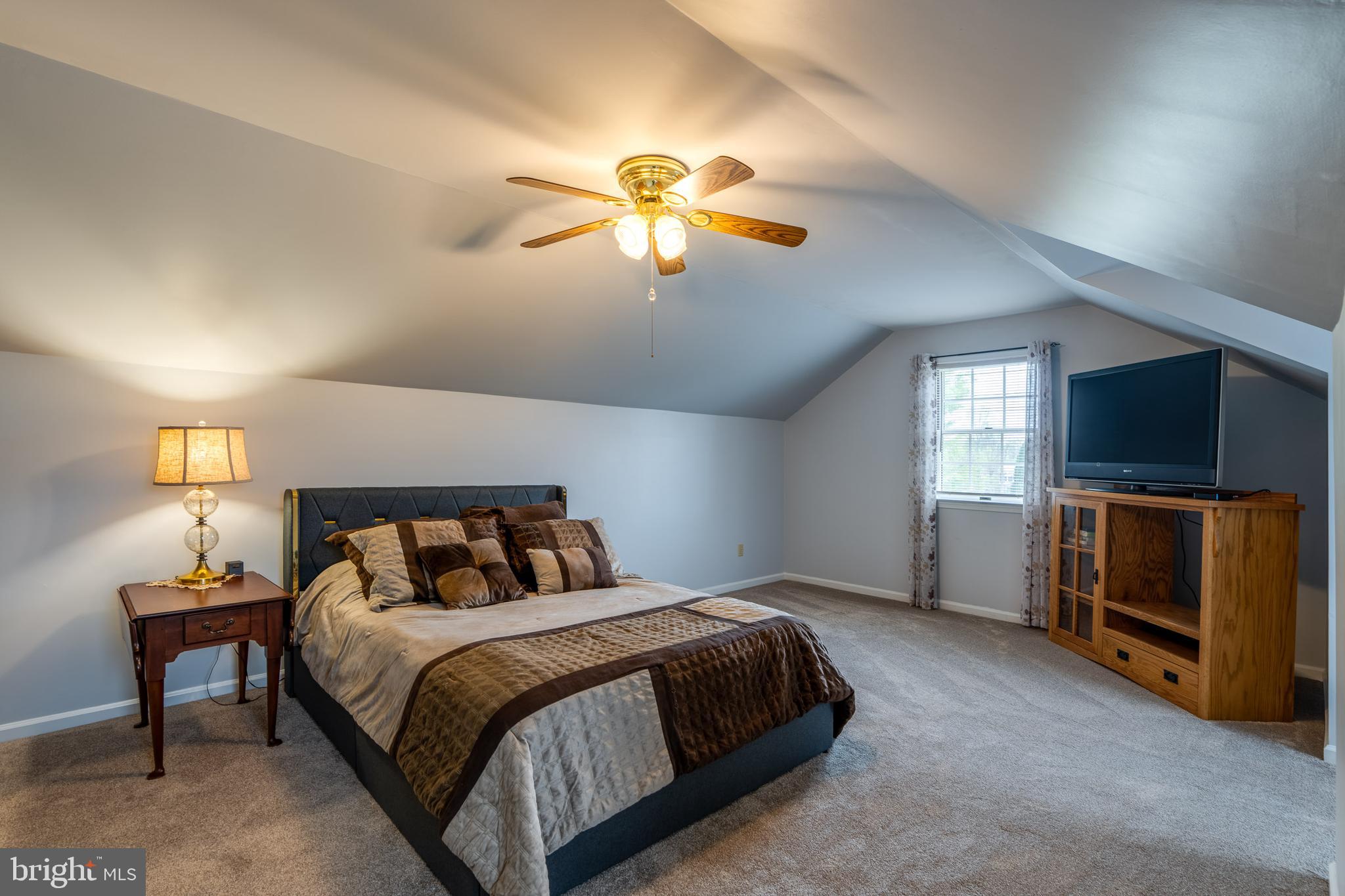 4442 Federal Road York, PA 17408 - Photo 54 of 69 a bedroom with a bed and a chandelier