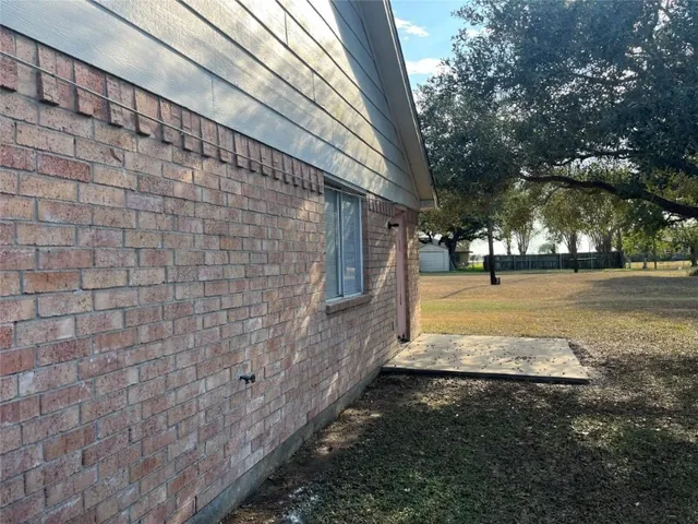 a view of a yard with an outdoor space