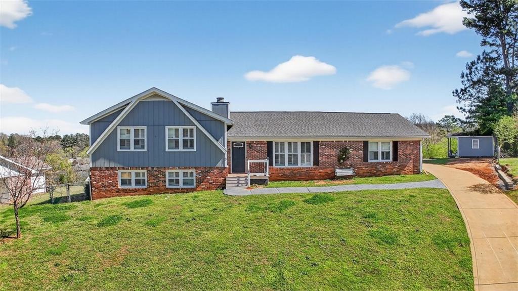 3 Berkshire Lane Rome, GA 30161 - Photo 1 of 44 a front view of a house with a yard table and chairs