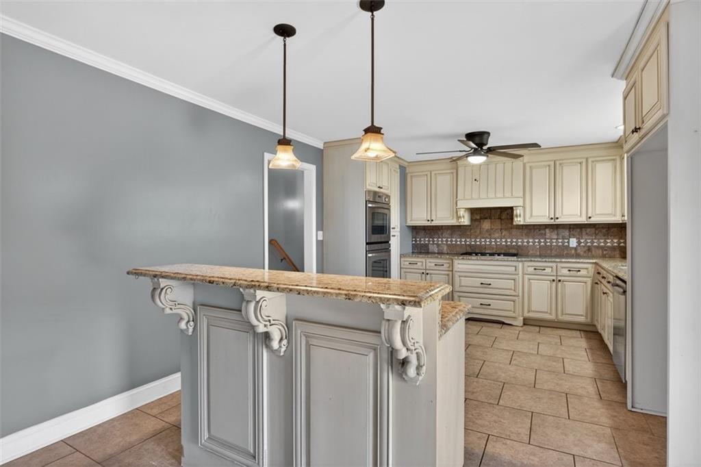 3 Berkshire Lane Rome, GA 30161 - Photo 12 of 44 a kitchen with granite countertop a sink cabinets and stainless steel appliances
