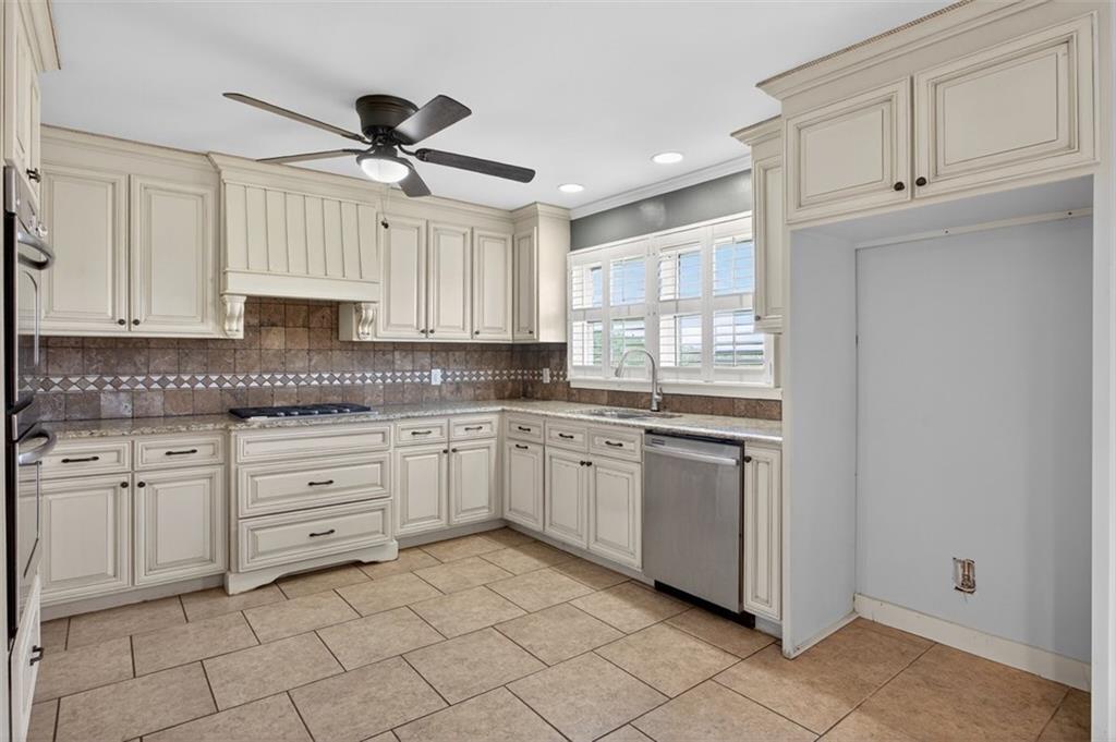 3 Berkshire Lane Rome, GA 30161 - Photo 14 of 44 a kitchen with granite countertop white cabinets stainless steel appliances and a window