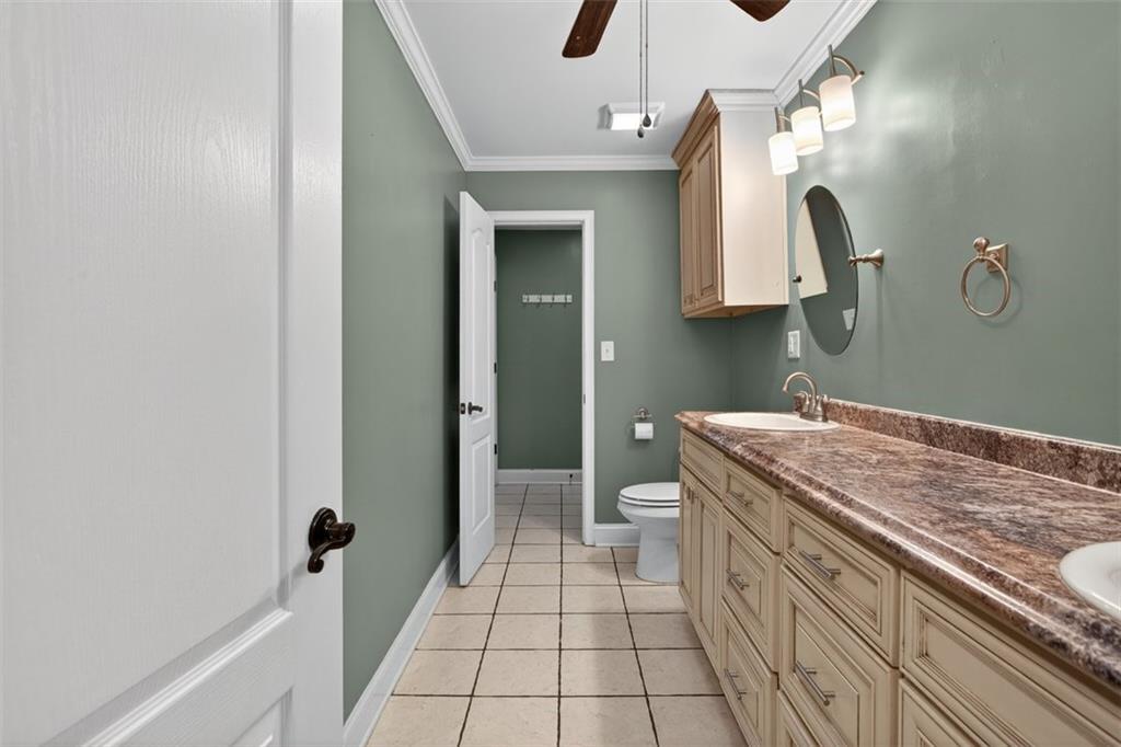 3 Berkshire Lane Rome, GA 30161 - Photo 18 of 44 a spacious bathroom with a granite countertop sink and a mirror