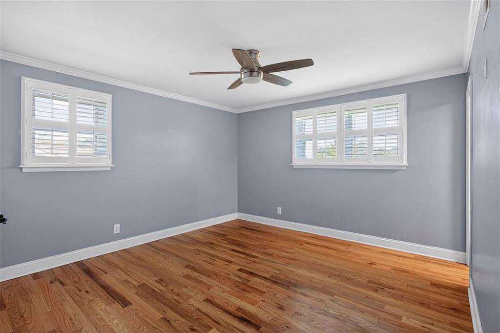 3 Berkshire Lane Rome, GA 30161 - Photo 20 of 44 a view of an empty room with wooden floor and a window