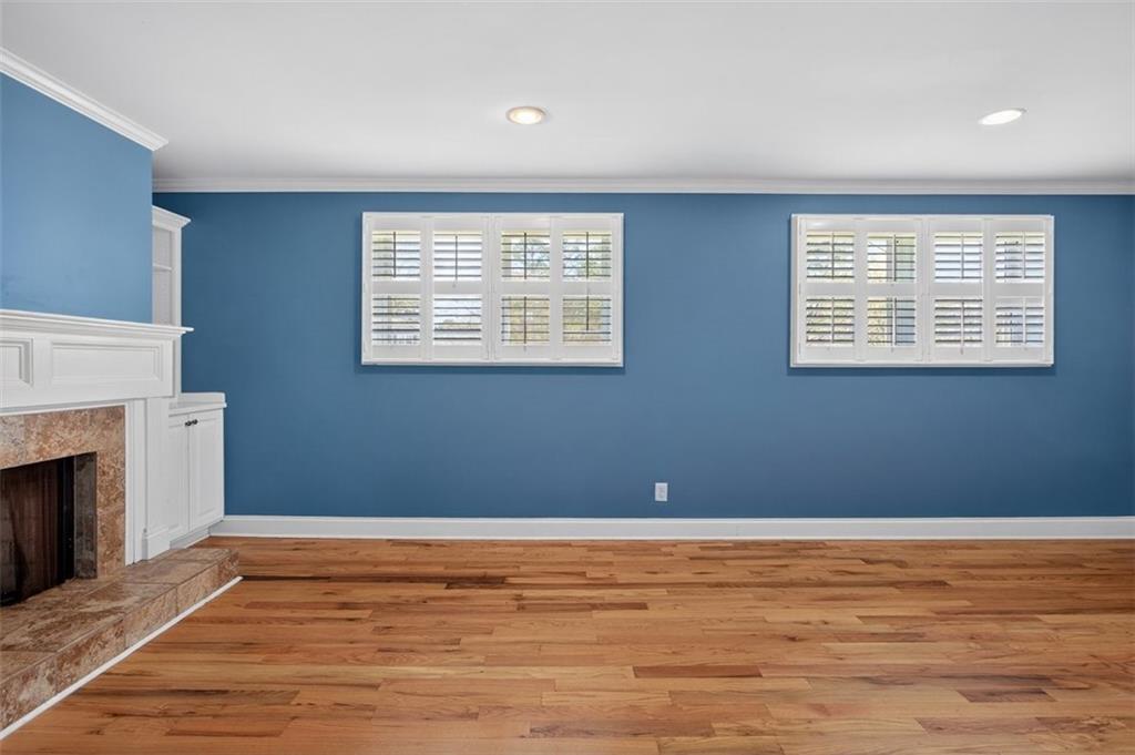 3 Berkshire Lane Rome, GA 30161 - Photo 22 of 44 a view of an empty room with wooden floor and a window