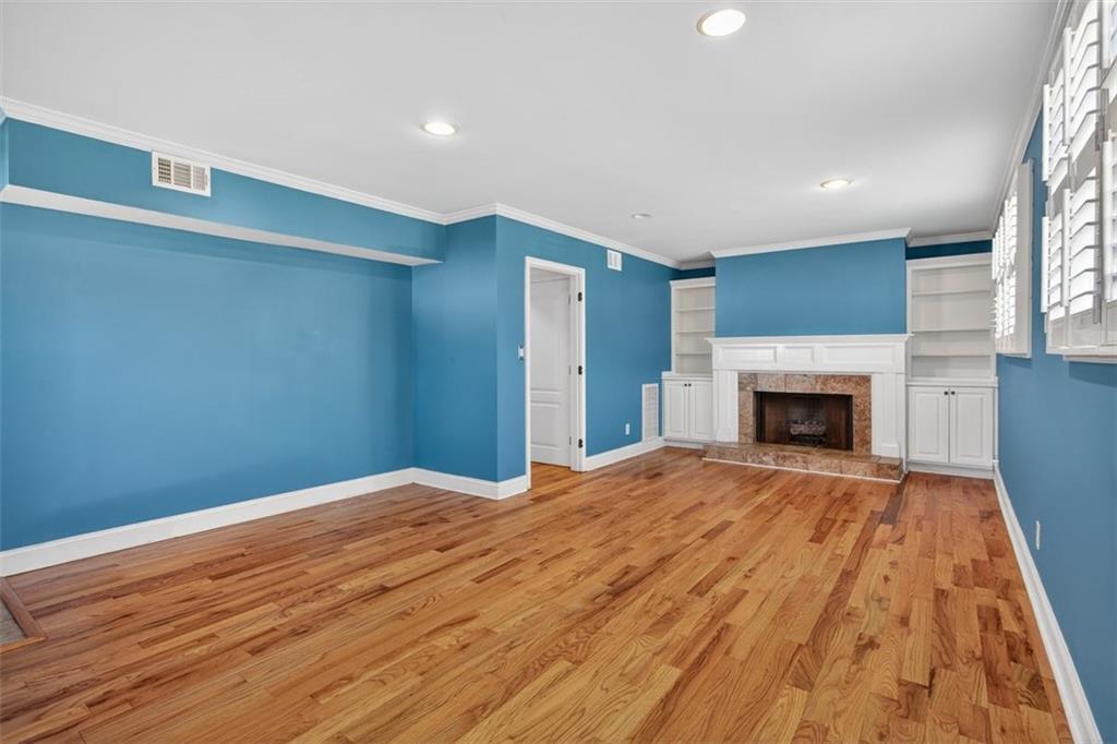 3 Berkshire Lane Rome, GA 30161 - Photo 24 of 44 a view of empty room with wooden floor and fireplace