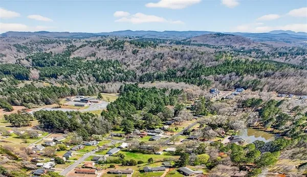 an aerial view of houses with yard