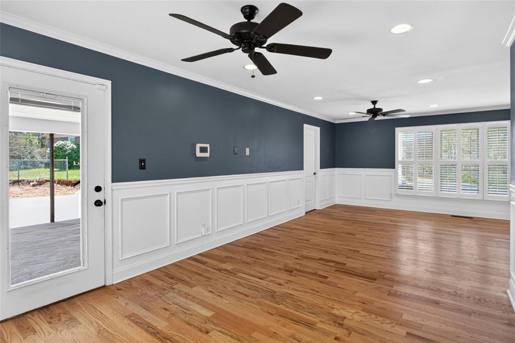 3 Berkshire Lane Rome, GA 30161 - Photo 10 of 44 a view of an empty room with a window and wooden floor