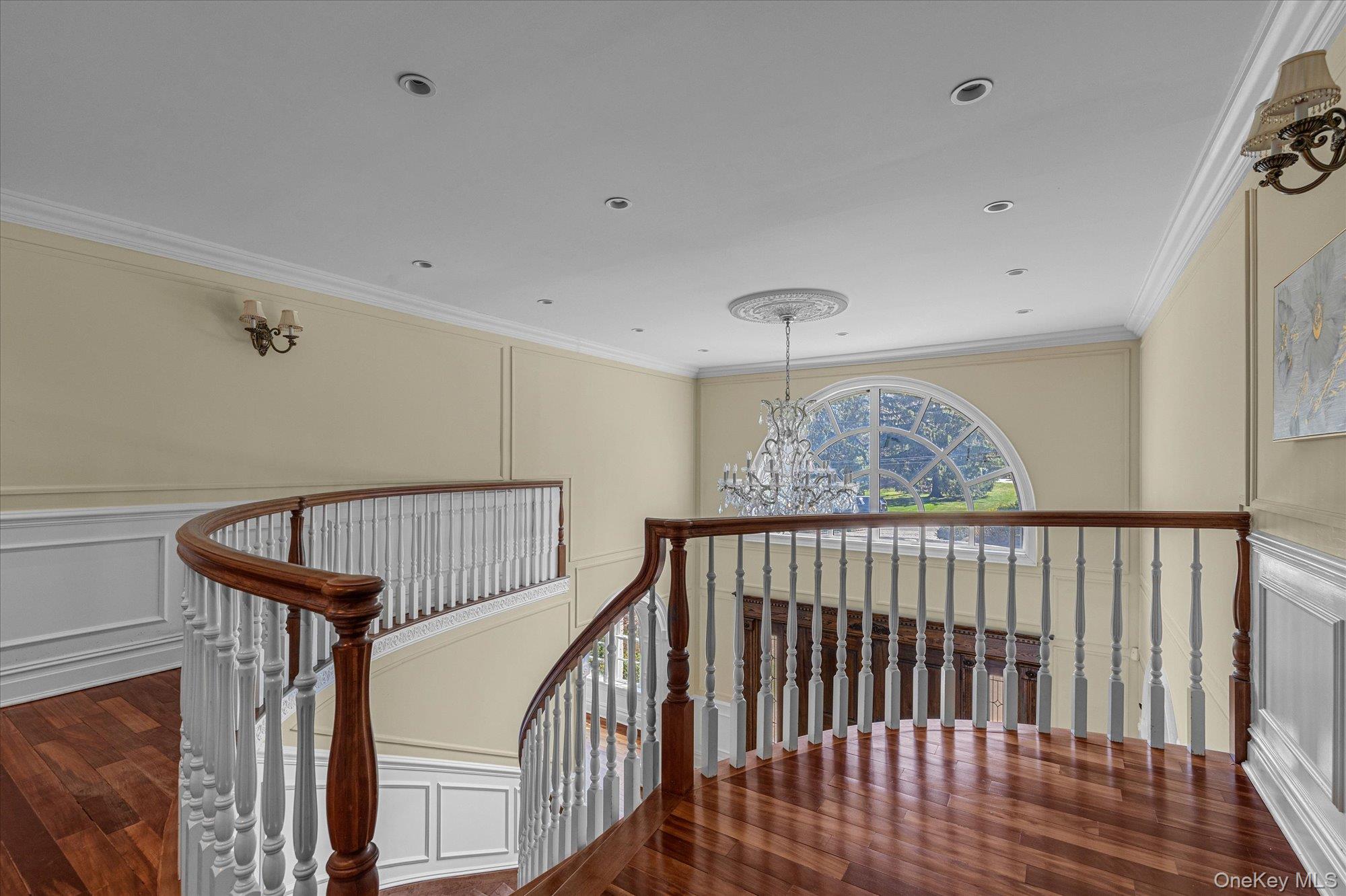 8 Norgate Road Glen Head, NY 11545 - Photo 16 of 37 a view of staircase with lots of frames on wall and wooden floor