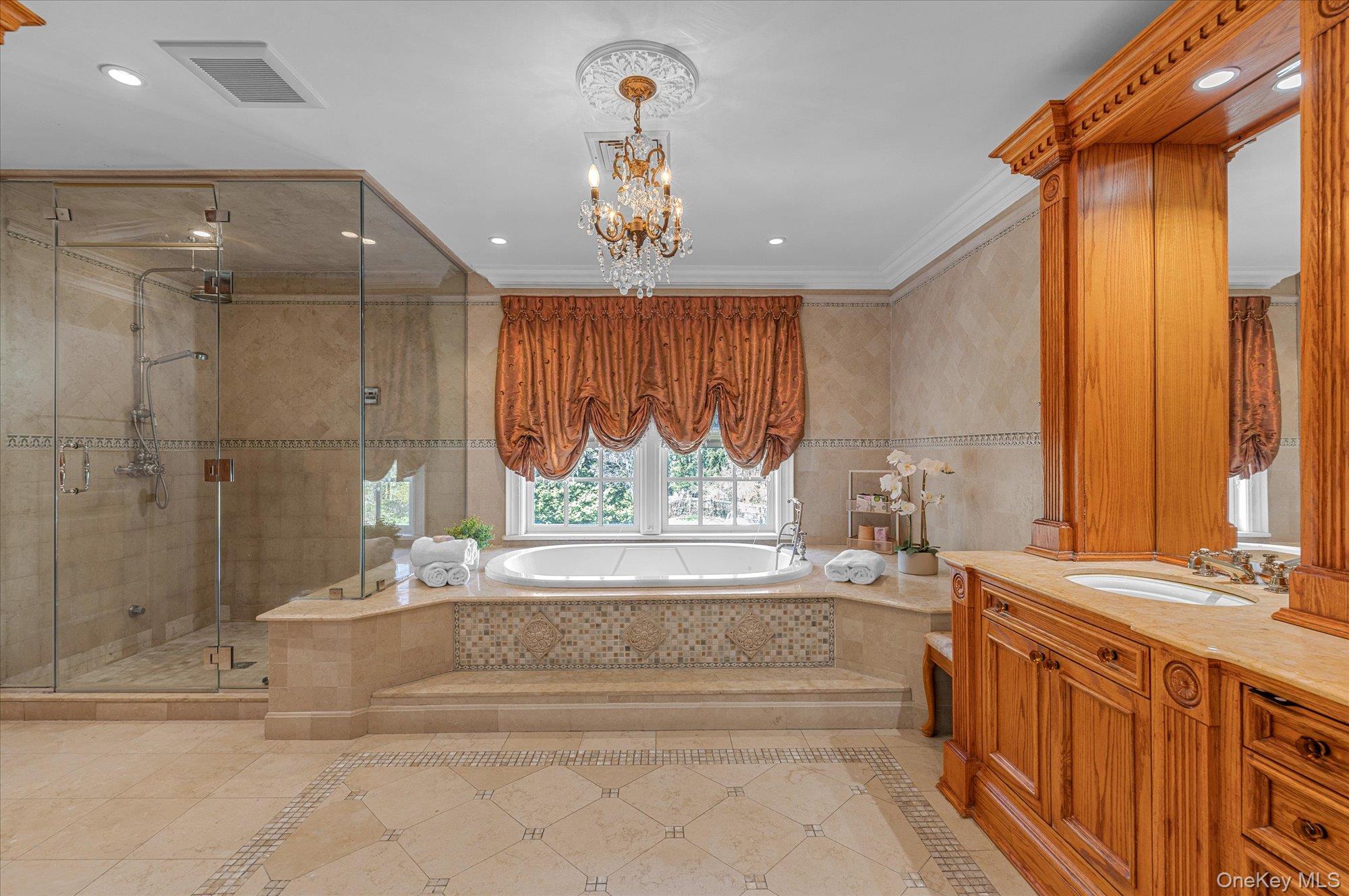 8 Norgate Road Glen Head, NY 11545 - Photo 19 of 37 a spacious bathroom with a double vanity sink and a bathtub
