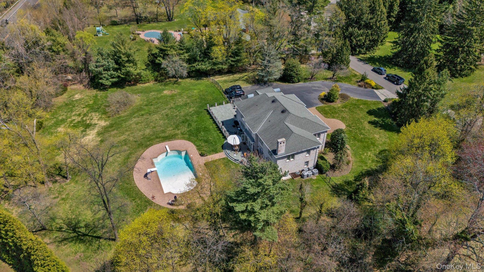 8 Norgate Road Glen Head, NY 11545 - Photo 37 of 37 an aerial view of a house with outdoor space and swimming pool