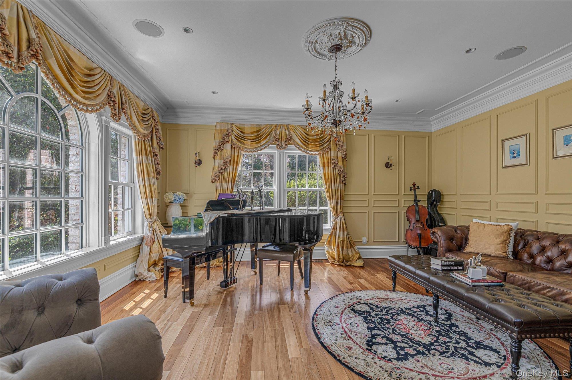 8 Norgate Road Glen Head, NY 11545 - Photo 4 of 37 a living room with fireplace furniture and a chandelier