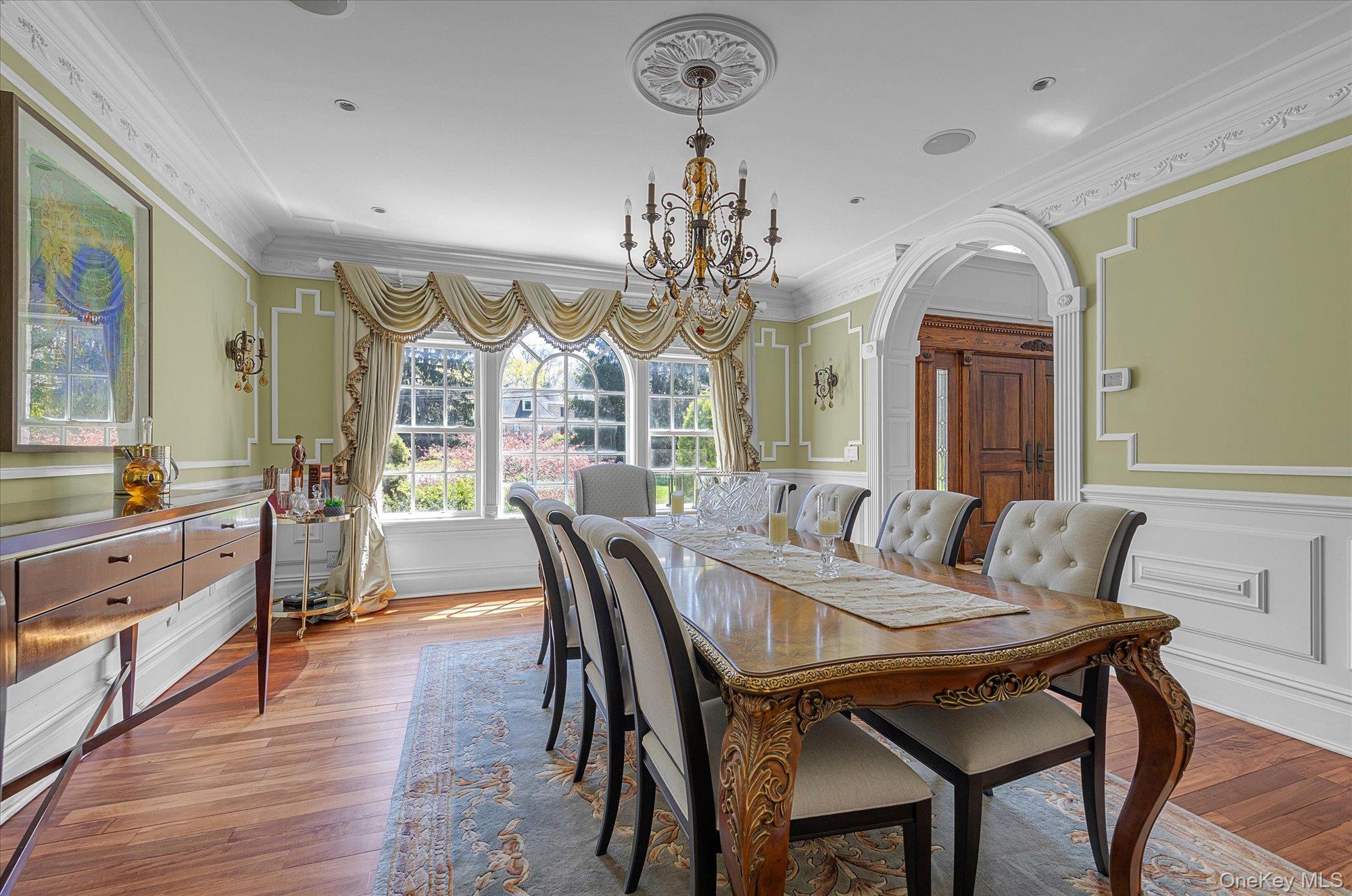 8 Norgate Road Glen Head, NY 11545 - Photo 6 of 37 a view of a dining room with furniture a chandelier and wooden floor