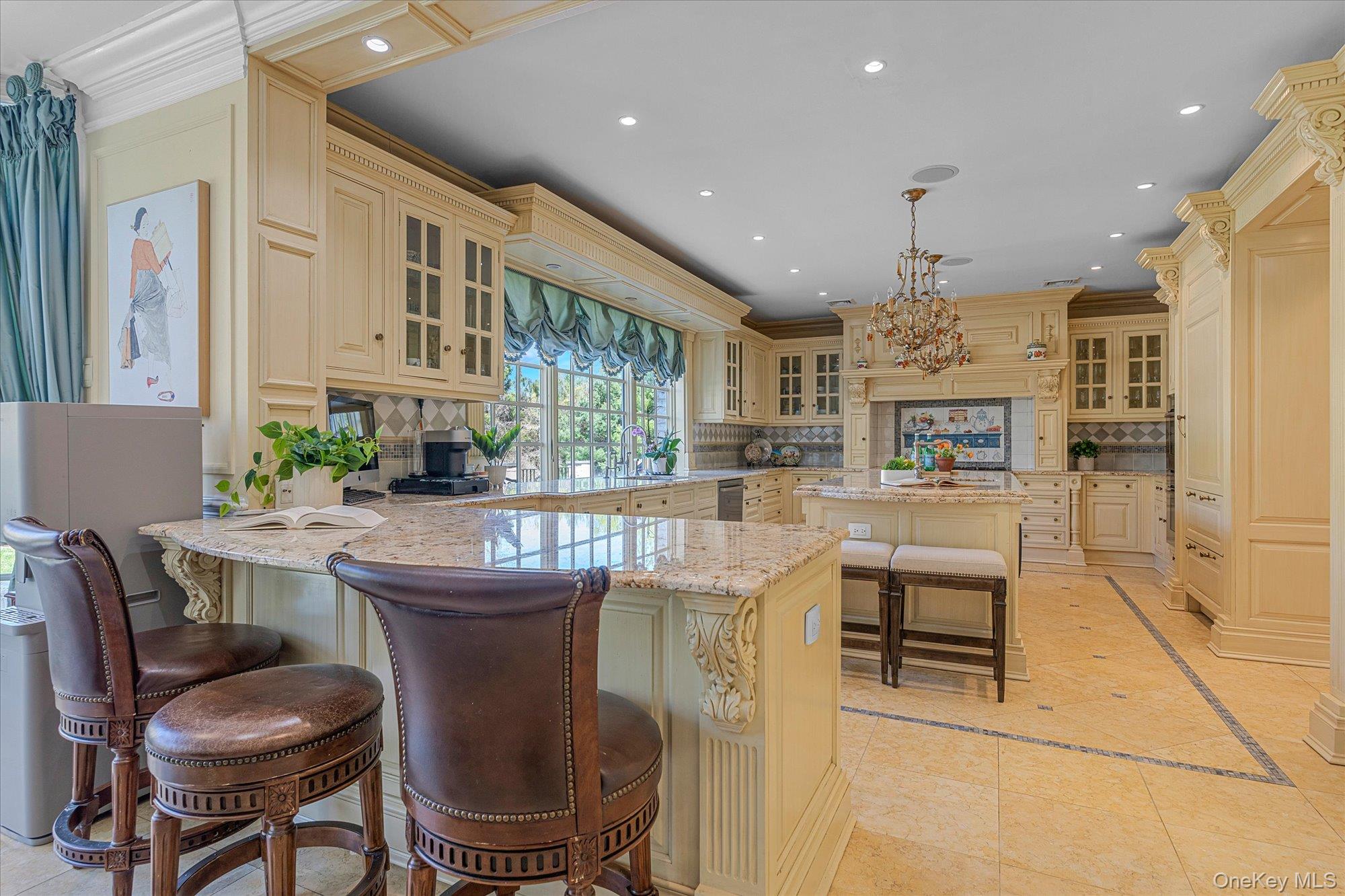 8 Norgate Road Glen Head, NY 11545 - Photo 10 of 37 a dining room with kitchen island a table and chairs