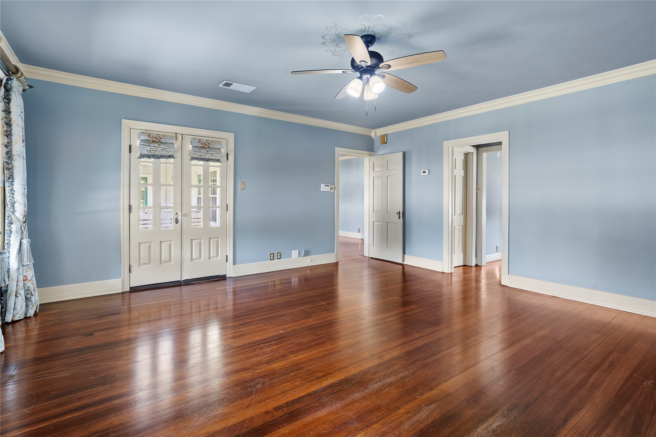 9827 FM 2759 Road Richmond, TX 77469 - Photo 27 of 50 a view of an empty room with wooden floor and a window