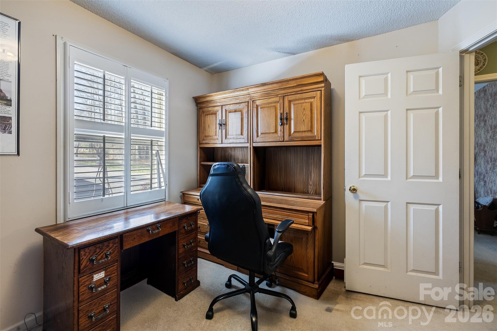 188 Oak Forest Circle Gaffney, SC 29341 - Photo 16 of 24 a view of a workspace with furniture and a window