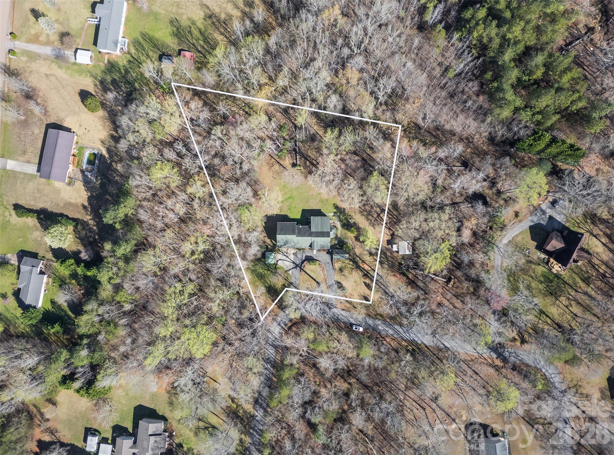 188 Oak Forest Circle Gaffney, SC 29341 - Photo 3 of 24 a backyard of a house with lots of plants and trees