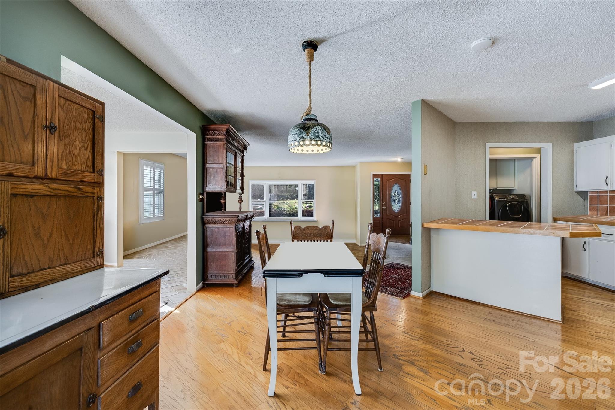188 Oak Forest Circle Gaffney, SC 29341 - Photo 8 of 24 a view of a dining room with furniture window and wooden floor