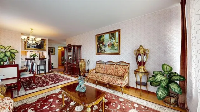a living room with furniture and a rug