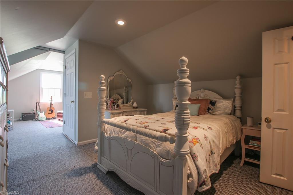 9252 Riverside Road Seagrove, NC 27341 - Photo 24 of 30 Upstairs, door to half bath right and downstairs to left