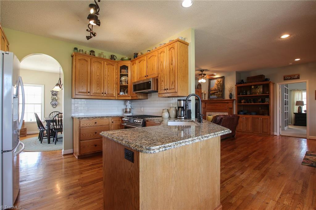 9252 Riverside Road Seagrove, NC 27341 - Photo 5 of 30 Kitchen, looking into Dining, LR, & MBR