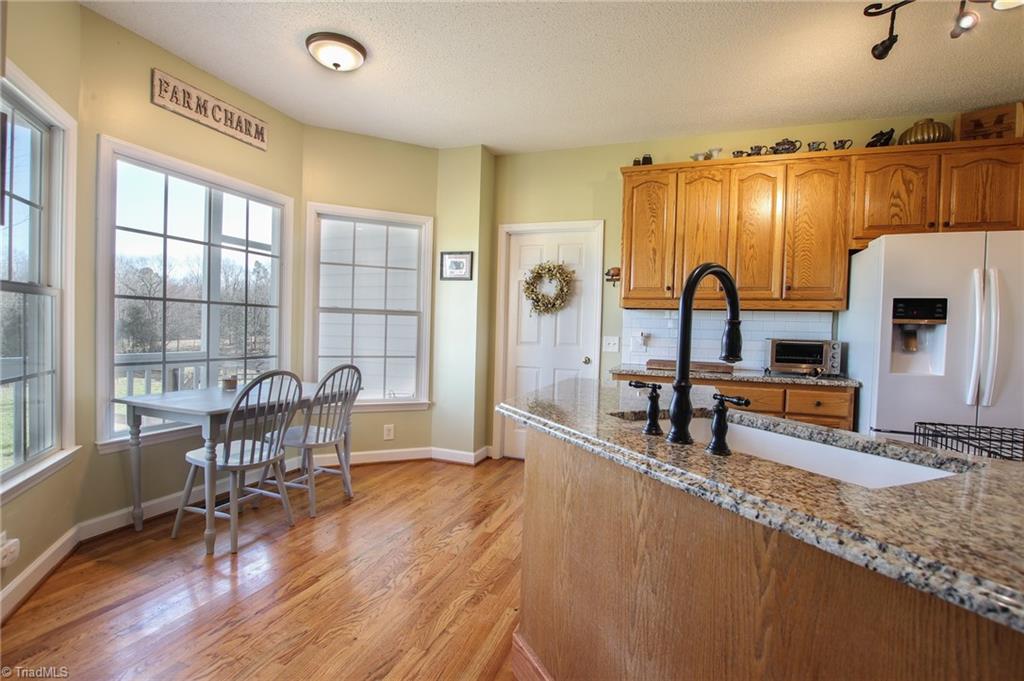 9252 Riverside Road Seagrove, NC 27341 - Photo 7 of 30 Kitchen & Breakfast Area, Door to Laundry/Garage/Office