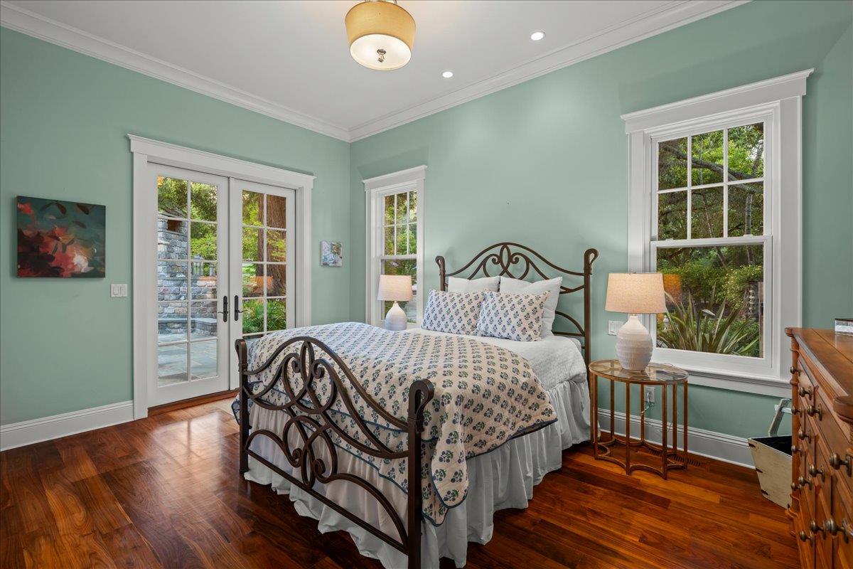 3510 Alpine Road Portola Valley, CA 94028 - Photo 23 of 77 a bedroom with a bed and wooden floor