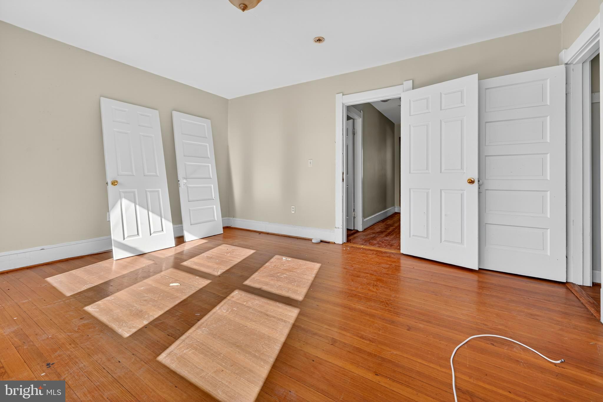 1211 Delafield Place Northwest Washington, DC 20011 - Photo 16 of 28 a view of a room with wooden floor and windows