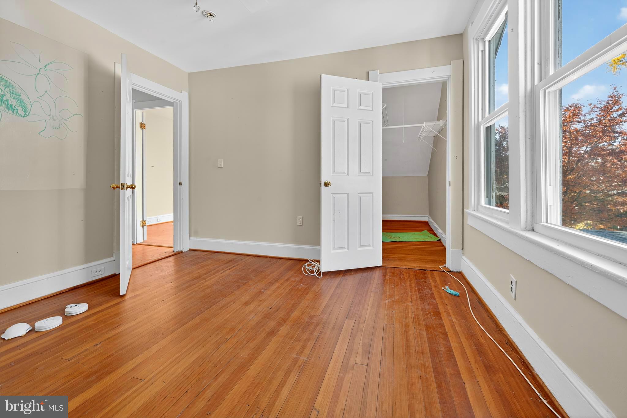 1211 Delafield Place Northwest Washington, DC 20011 - Photo 18 of 28 a view of an empty room with wooden floor and a window