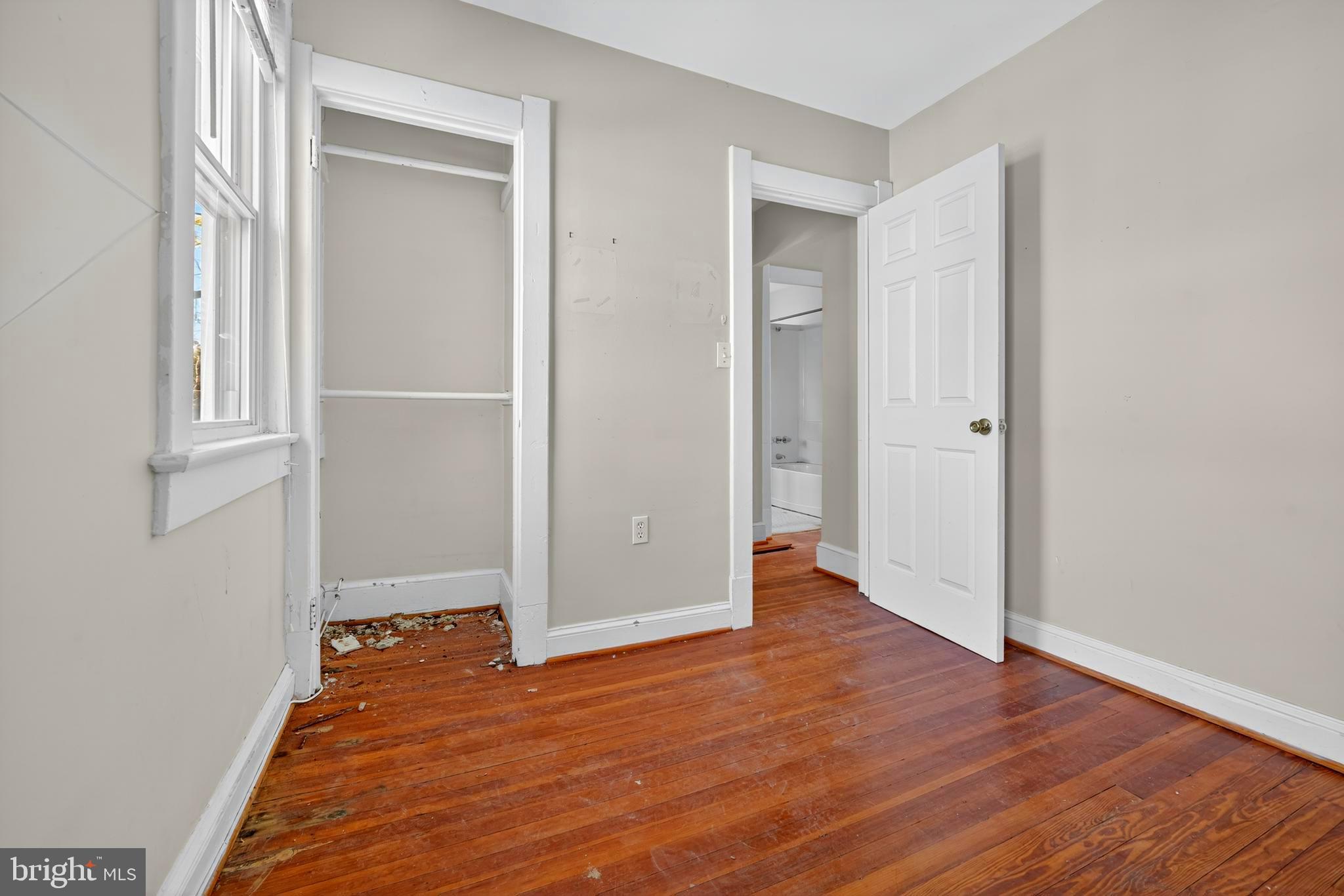 1211 Delafield Place Northwest Washington, DC 20011 - Photo 21 of 28 an empty room with wooden floor and entrance