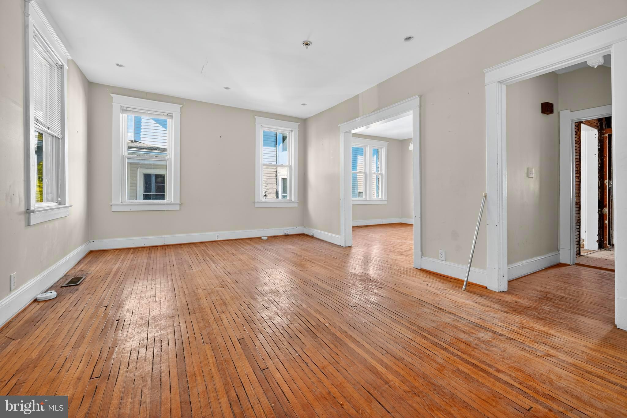 1211 Delafield Place Northwest Washington, DC 20011 - Photo 7 of 28 an empty room with wooden floor and windows