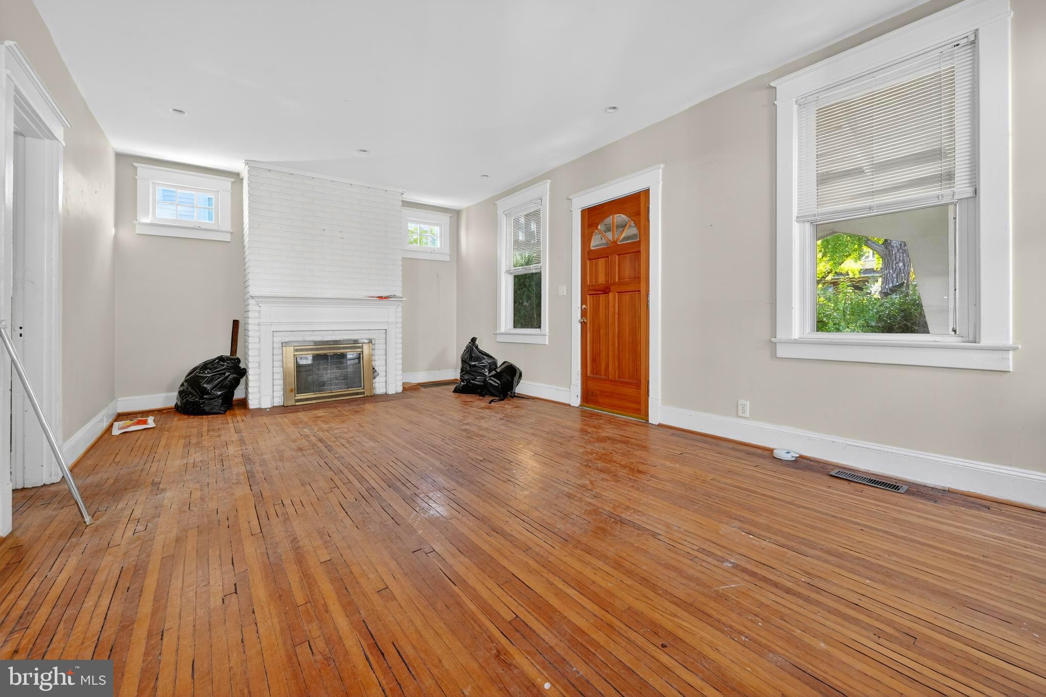 1211 Delafield Place Northwest Washington, DC 20011 - Photo 8 of 28 a view of empty room with wooden floor and fan