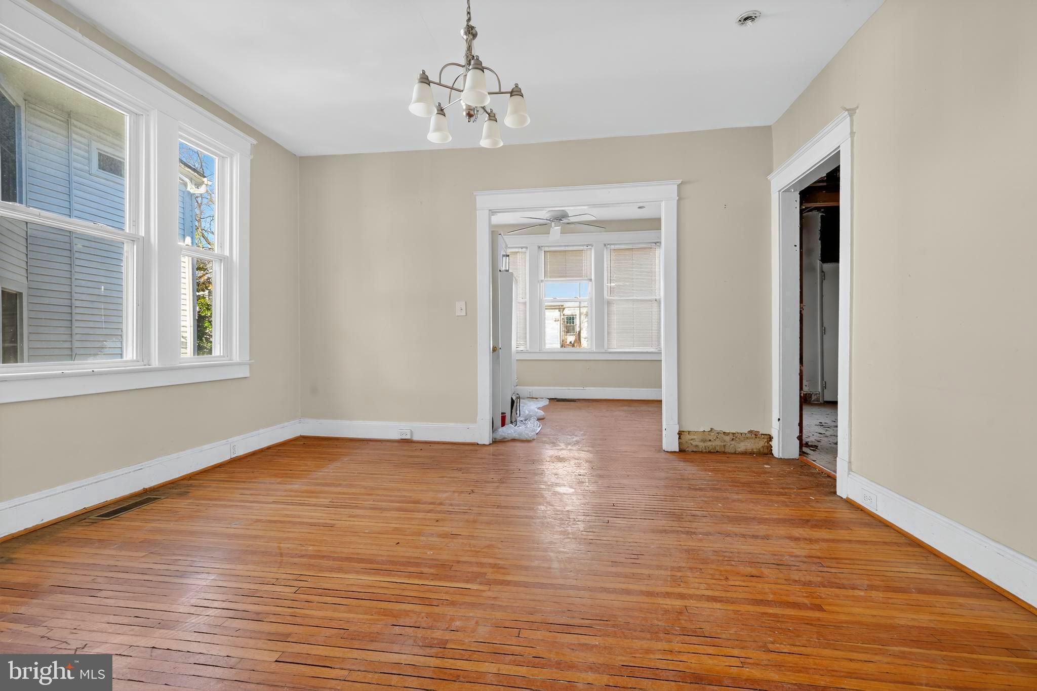 1211 Delafield Place Northwest Washington, DC 20011 - Photo 9 of 28 a view of empty room with wooden floor and fan