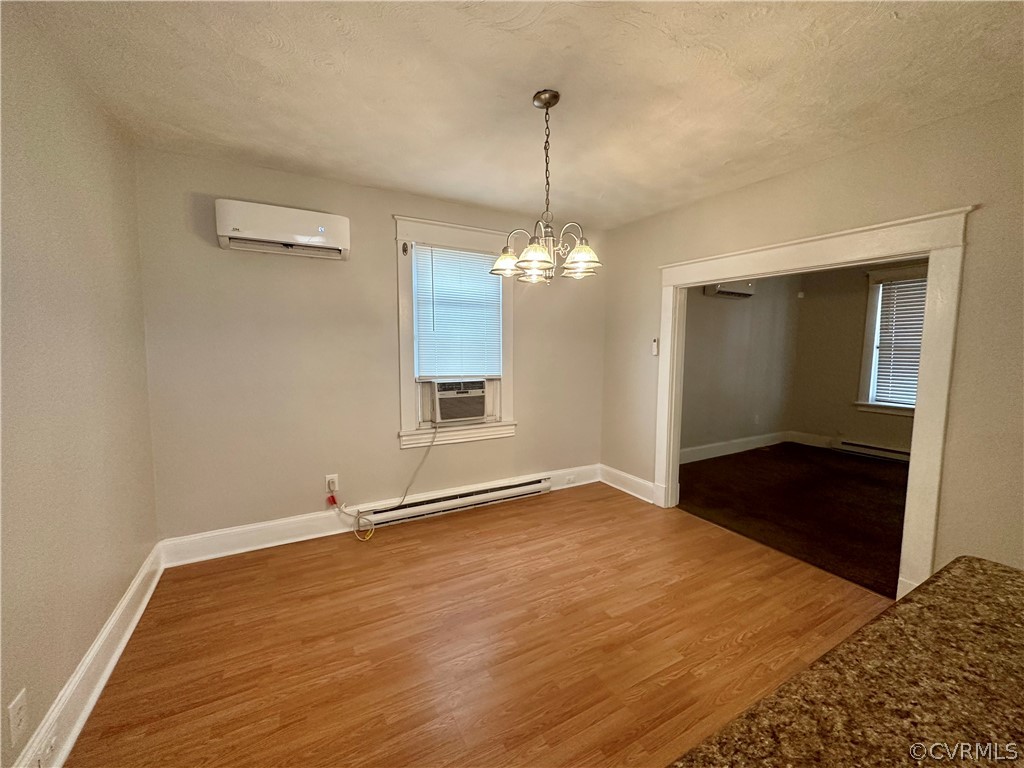 1417 Williamsburg Road Richmond, VA 23231 - Photo 12 of 35 a view of an empty room with wooden floor and a window