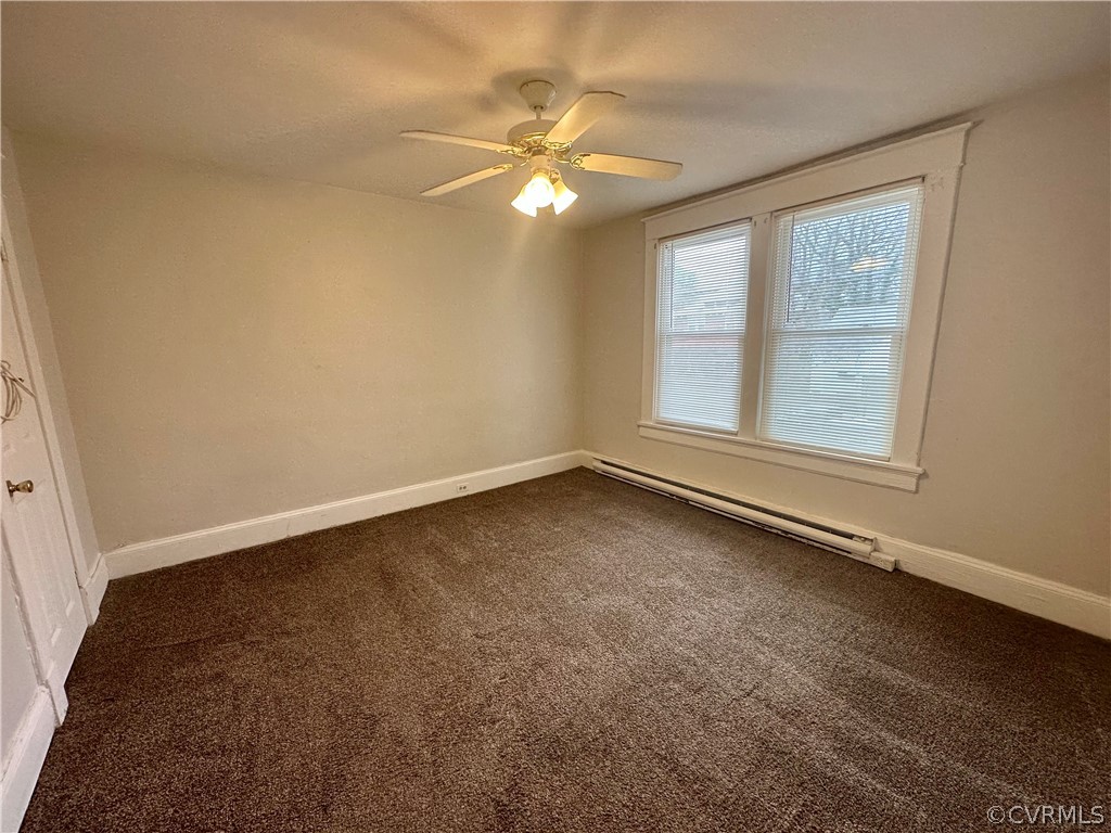 1417 Williamsburg Road Richmond, VA 23231 - Photo 17 of 35 an empty room with chandelier fan and windows