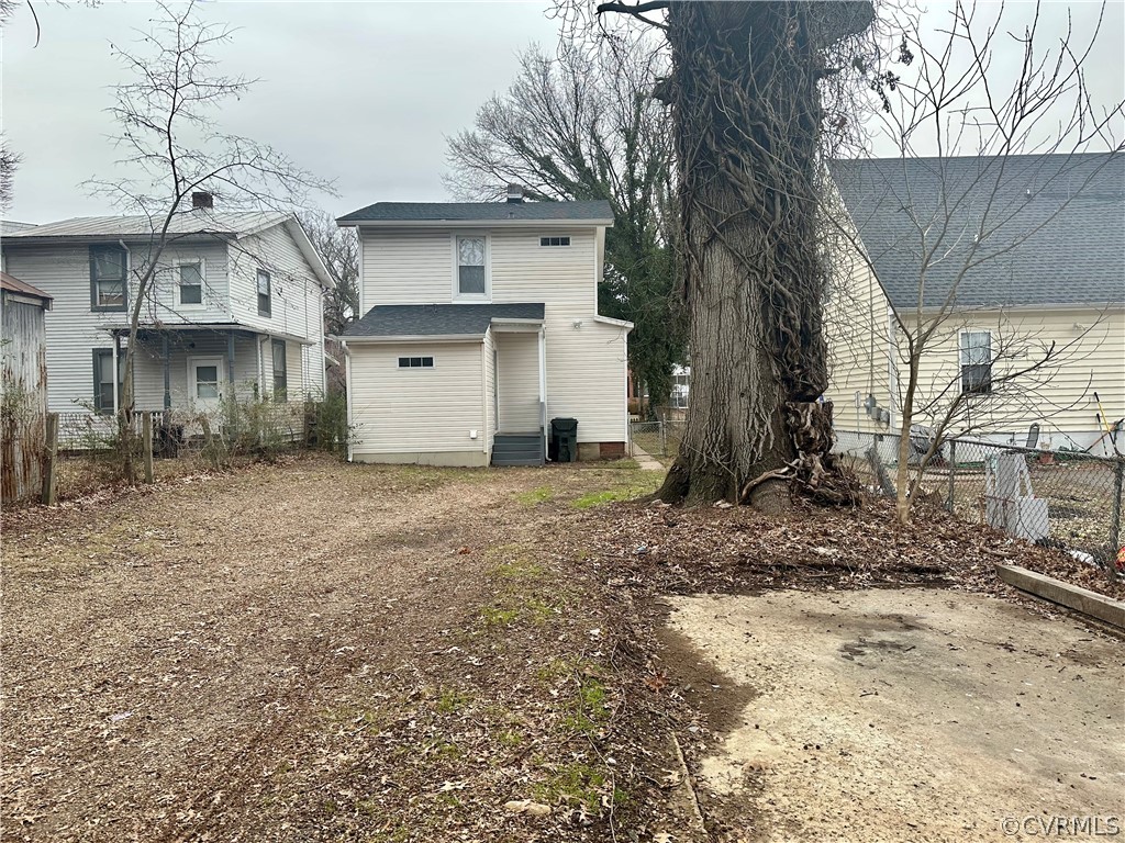 1417 Williamsburg Road Richmond, VA 23231 - Photo 28 of 35 a view of a house with a yard covered in the middle