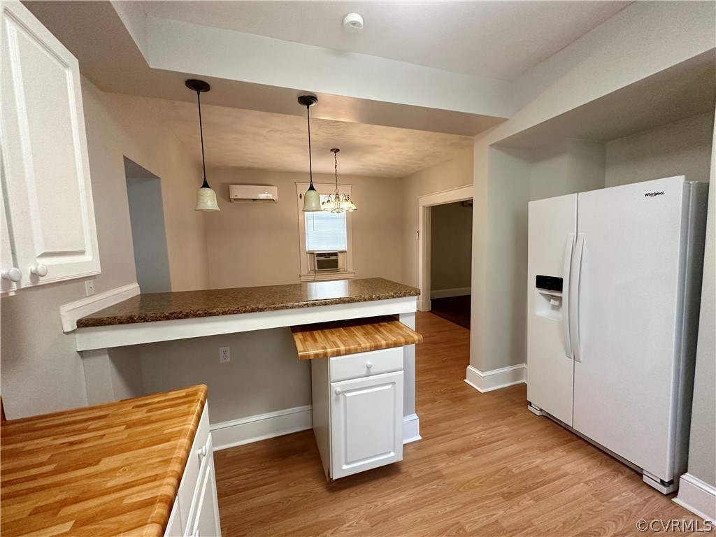 1417 Williamsburg Road Richmond, VA 23231 - Photo 6 of 35 a kitchen with stainless steel appliances a refrigerator a sink and wooden floors