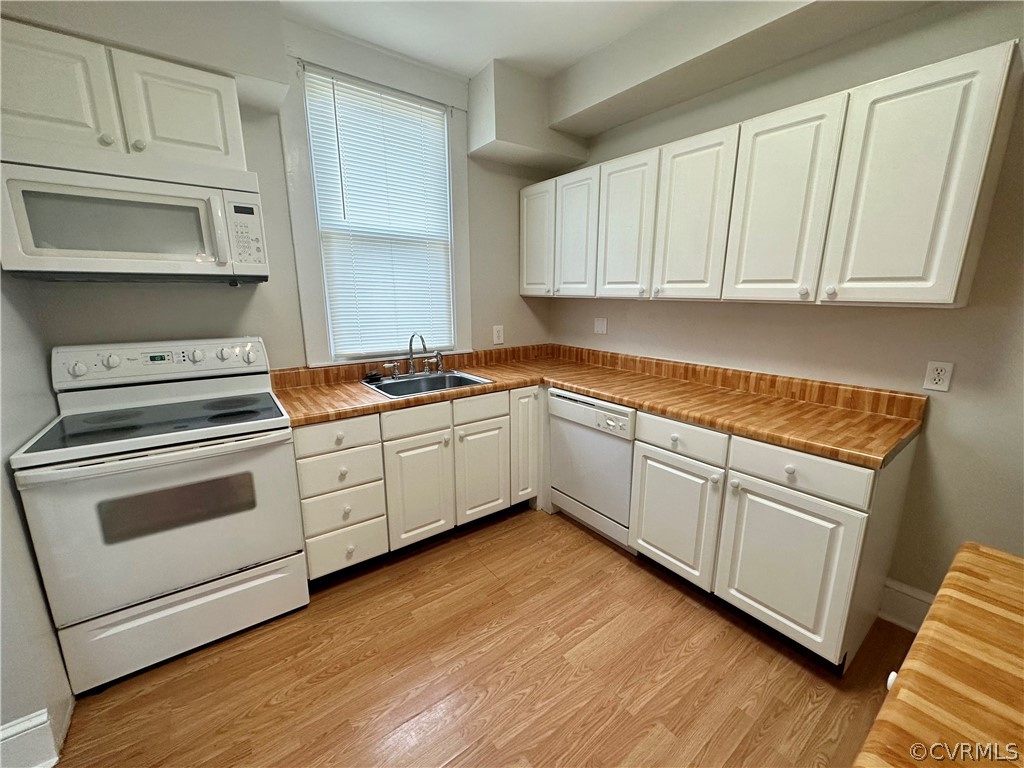 1417 Williamsburg Road Richmond, VA 23231 - Photo 7 of 35 a kitchen with granite countertop white cabinets and white appliances