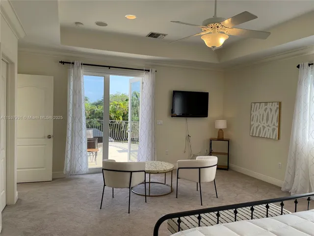 a view of a livingroom with furniture window and wooden floor