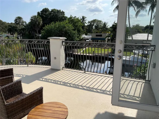 a view of balcony with furniture