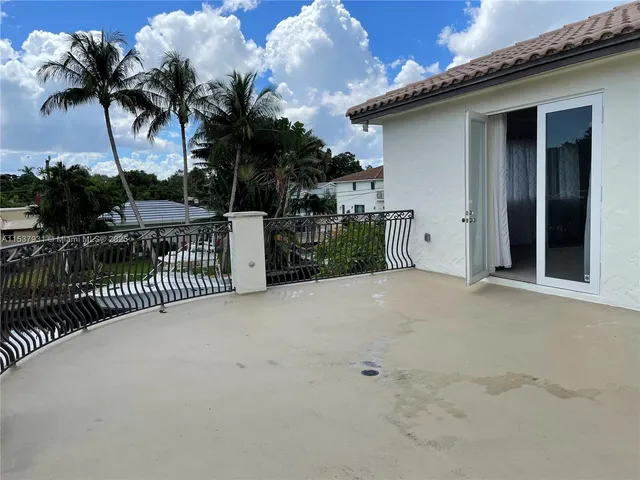 a view of a house with a roof deck