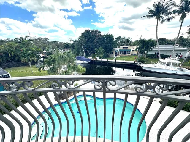 a view of a balcony with chairs