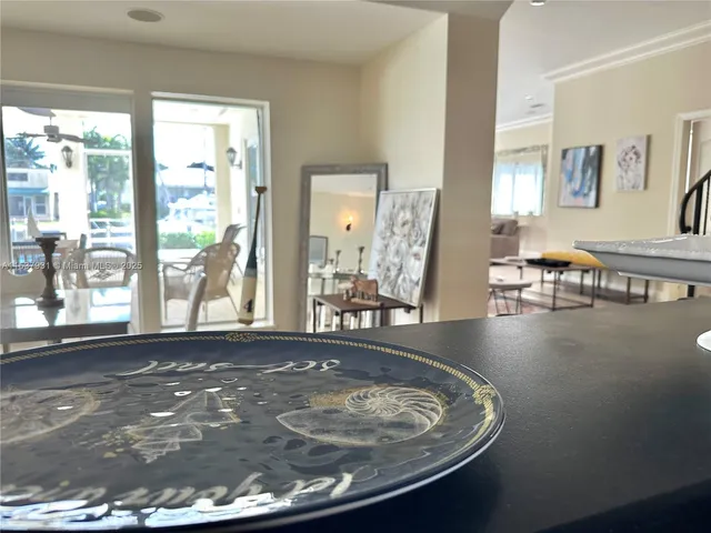 a view of a livingroom with furniture wooden floor and a rug