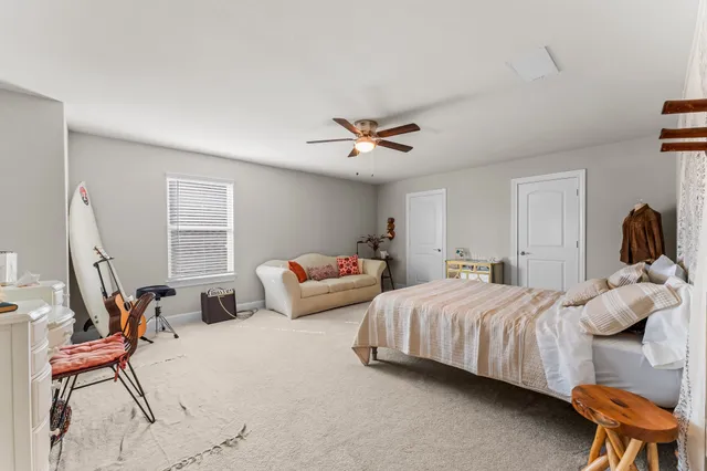 a bedroom with a bed and a couch