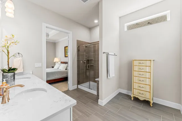 a en suite bathroom with a sink and a shower