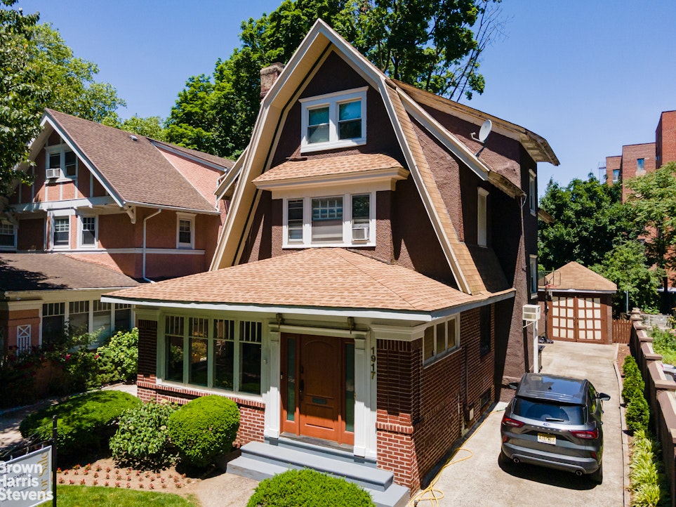 1917 Glenwood Road Brooklyn, NY 11230 - Photo 21 of 22 a front view of a house with a yard