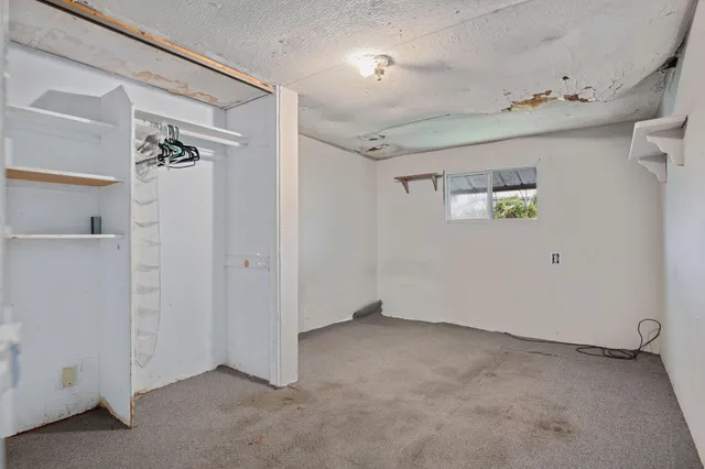 a bathroom with a granite countertop sink a toilet and a bathtub