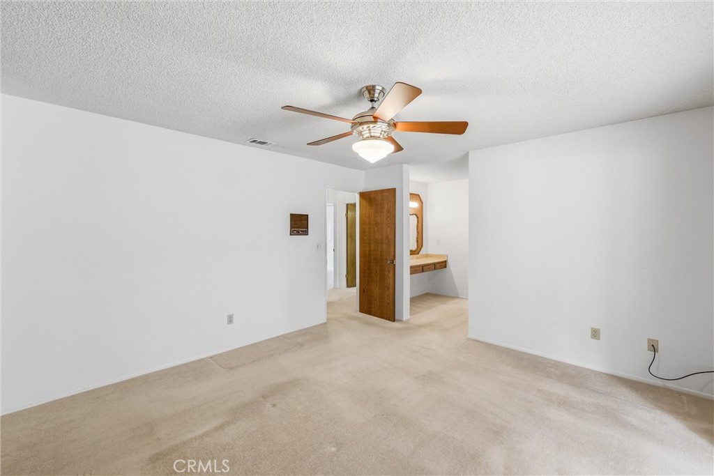 37295 Oak View Road Yucaipa, CA 92399 - Photo 32 of 59 a view of a livingroom with a ceiling fan and chandelier fan